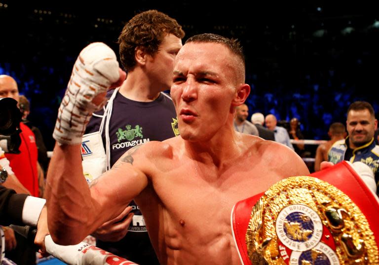 Josh Warrington earns hard-fought victory over Kid Galahad to retain IBF world featherweight title