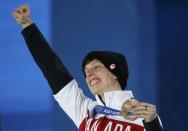 Bronze medallist Canada's Charle Cournoyer celebrates during the victory ceremony for the men's 500 metres short track speed skating event at the 2014 Sochi Winter Olympics in Sochi, February 22, 2104. REUTERS/Jim Young (RUSSIA - Tags: OLYMPICS SPORT SPEED SKATING)