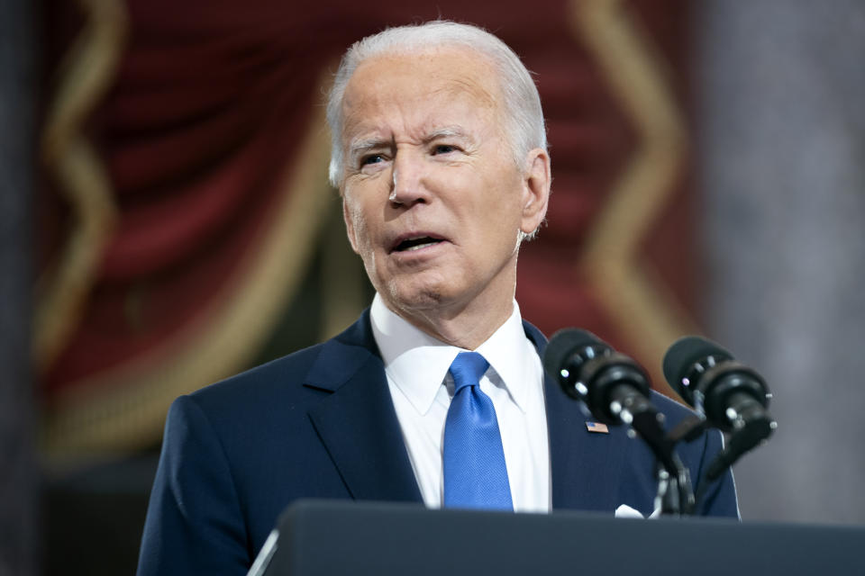 President Joe Biden speaks from Statuary Hall at the U.S. Capitol to mark the one year anniversary of the Jan. 6 riot at the Capitol by supporters loyal to then-President Donald Trump, Thursday, Jan. 6, 2022, in Washington. (Greg Nash/Pool via AP)