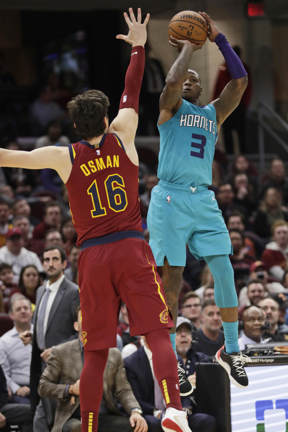 Charlotte Hornets' Terry Rozier (3) shoots over Cleveland Cavaliers' Cedi Osman (16) in the second half of an NBA basketball game, Thursday, Jan. 2, 2020, in Cleveland. (AP Photo/Tony Dejak)