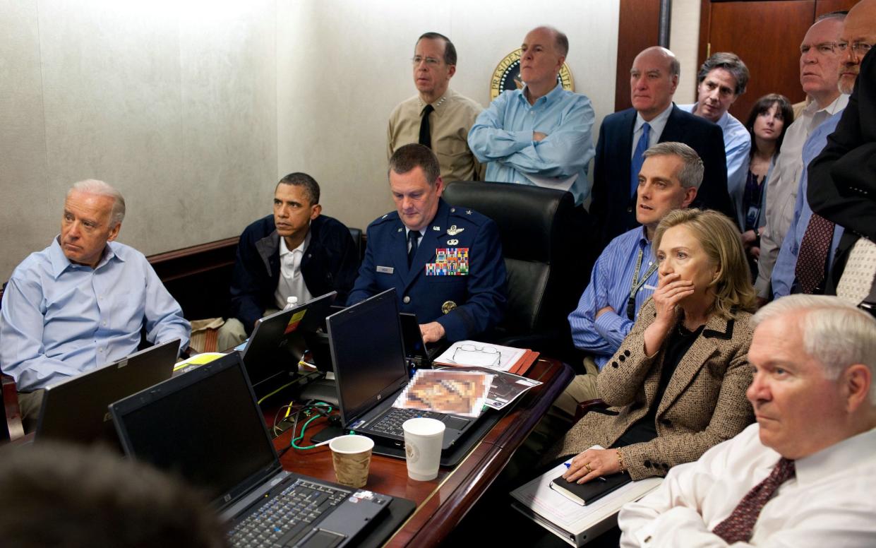 Former US president Barack Obama and his national security team in the White House Situation Room