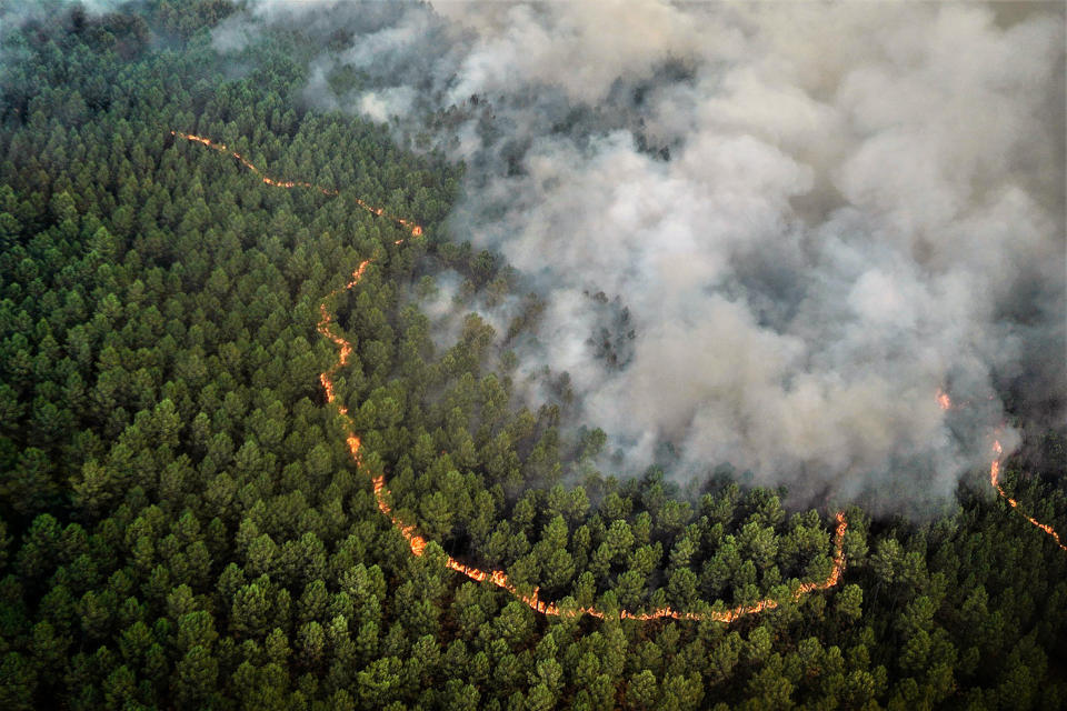 This photo provided by the fire brigade of the Gironde region SDIS 33, (Departmental fire and rescue service 33) shows an aerial view of a blaze near Saint-Magne, south of Bordeaux, southwestern France, Thursday, Aug. 11, 2022. (SDIS 33 via AP)