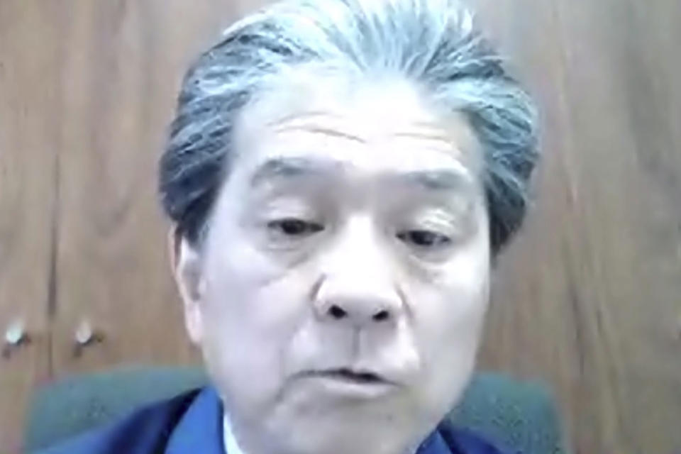 In this image from video released by TEPCO, Akira Ono, chief decommissioning officer of the Fukushima Dai-ichi nuclear power plant, speaks during a video interview in Tokyo Tuesday, March 2, 2021. The head of the wrecked Fukushima nuclear plant said Tuesday there's no need to extend the current target to finish its decommissioning in 30-40 years despite uncertainties about melted fuel inside the plant's three reactors. (TEPCO via AP)