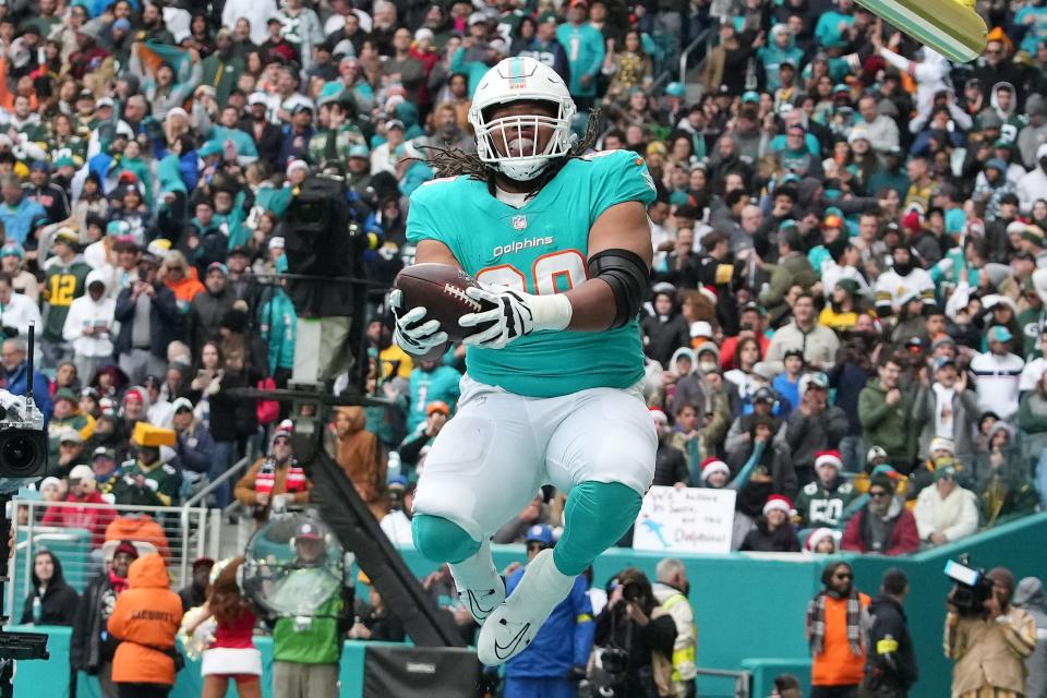 MIAMI GARDENS, FLORIDA - DECEMBER 25: Robert Hunt #68 of the Miami Dolphins attempts to spike the ball during the second quarter of the game against the Green Bay Packers at Hard Rock Stadium on December 25, 2022 in Miami Gardens, Florida. (Photo by Eric Espada/Getty Images)