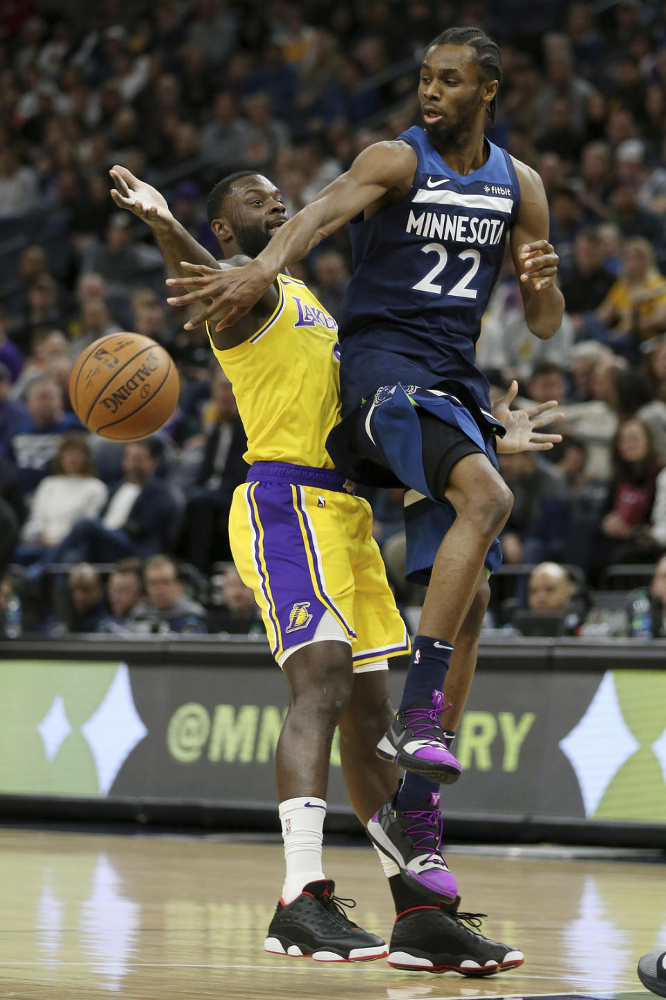 Minnesota Timberwolves' Andrew Wiggins tries to pass the ball over Los Angeles Lakers' Lance Stephenson in the first half of an NBA basketball game Sunday, Jan. 6, 2019, in Minneapolis. (AP Photo/Stacy Bengs)