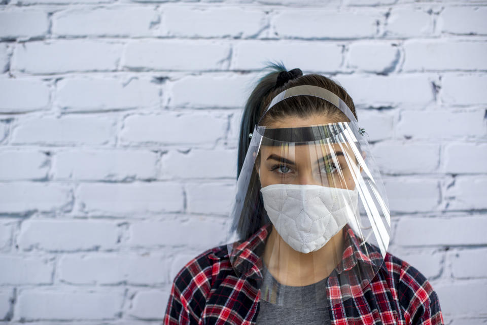 Woman wearing protective face mask in the office for safety and protection during COVID-19 There has been only one case of H5N1 in humans confirmed in Canada to date. (Getty Images)