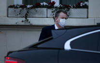 Britain's chief negotiator David Frost leaves the UK ambassadors residence in Brussels, Sunday, Dec. 20, 2020. The EU and the United Kingdom are still working on a "last attempt" to clinch a post-Brexit trade deal, with EU fishing rights in British waters the most notable remaining obstacle to avoid a chaotic and costly changeover on New Year. (AP Photo/Virginia Mayo)
