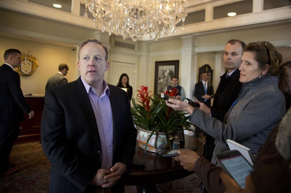 White House press secretary Sean Spicer, speaks to reporters as President Donald Trump meets with some members of his cabinet and the White House staff, Saturday, March 11, 2017, at the Trump National Golf Club in Sterling, Va. (AP Photo/Manuel Balce Ceneta)