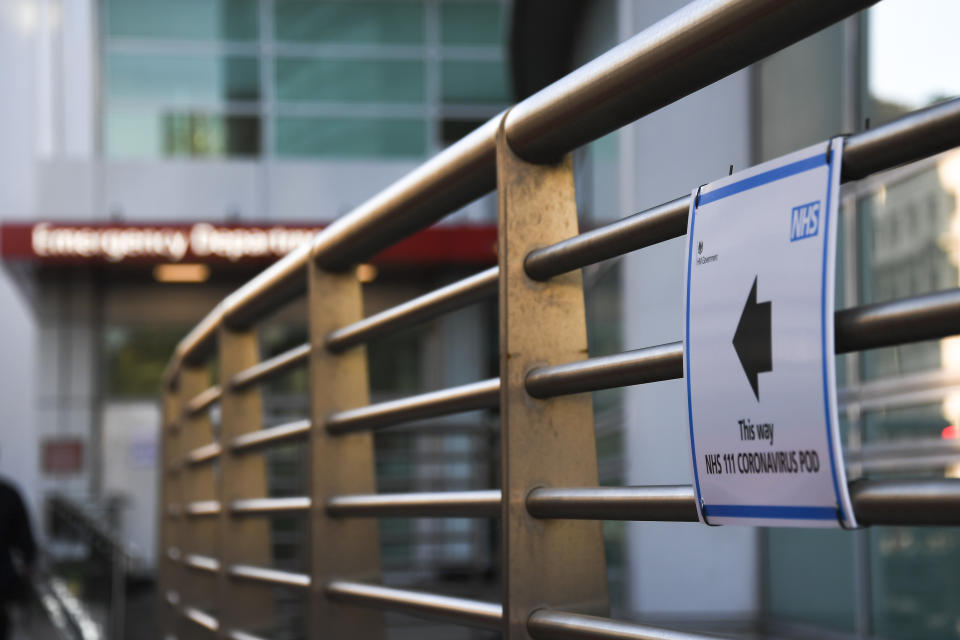 A sign indicating a Coronavirus Pod is seen outside the London University College Hospital, in London, Friday, March 6, 2020. Fearing a possible shortage in protective equipment, health ministers from the European Union are holding an emergency meeting to try to improve their collective response to the novel coronavirus outbreak. (AP Photo/Alberto Pezzali)