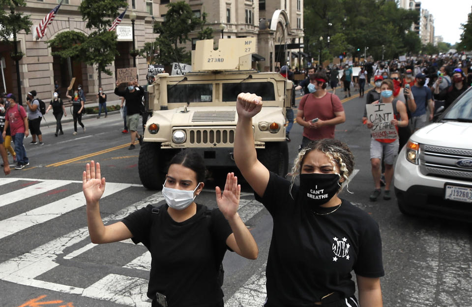 Demonstrators march as they protest the death of George Floyd, Tuesday, June 2, 2020, in Washington. Floyd died after being restrained by Minneapolis police officers. (AP Photo/Alex Brandon)