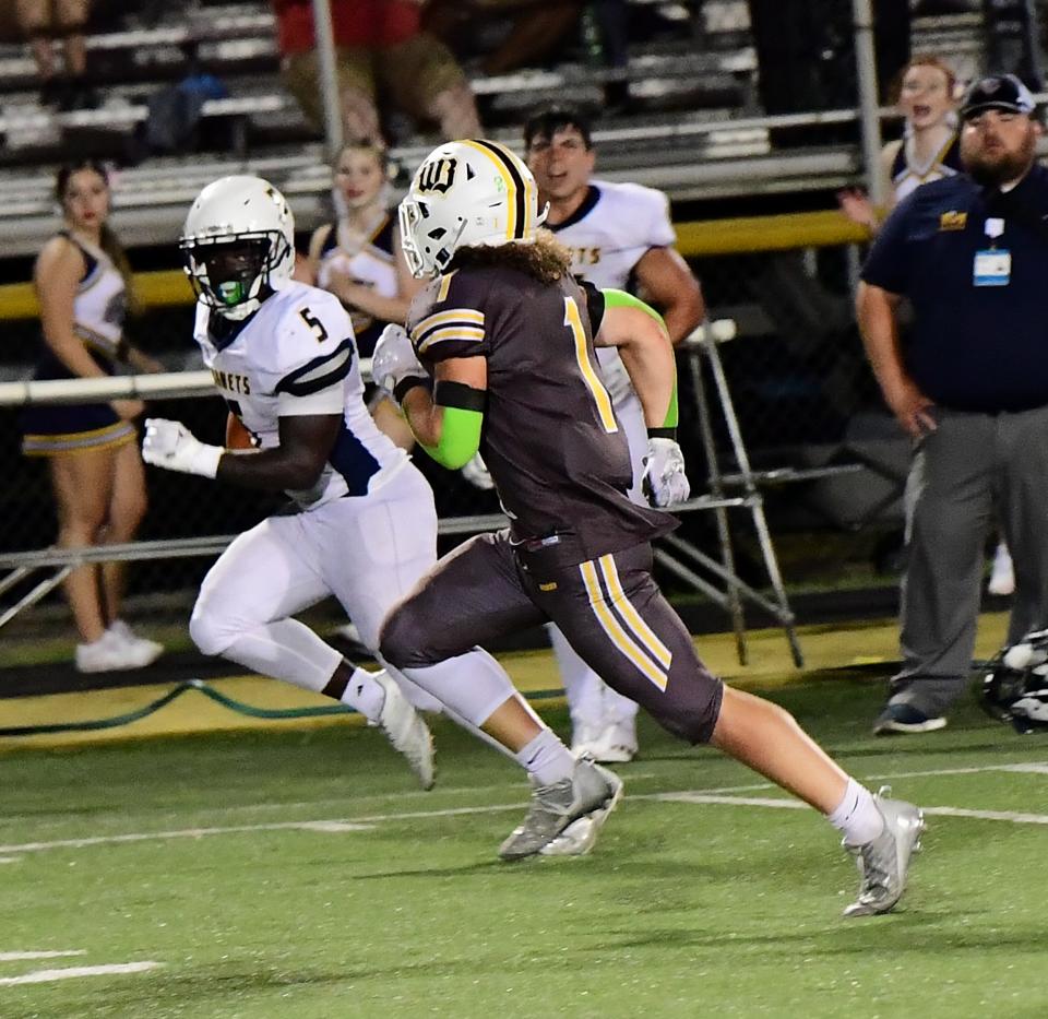 Monroe's E.J. Jyan (5) is off to the endzone for a Hornets' touchdown at the Monroe vs. Western Brown football game Friday, Sept. 2, 2022.