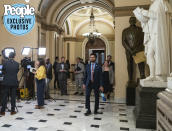 <p>Frost leaves the House chamber after finishing his final floor vote of the week. He has a quick break before attending a meeting with members of the Congressional Hispanic Caucus, and debates whether there's time to drop some things off at his office in an adjacent building. "Well, it <em>is</em> the Hispanic caucus," he chuckles, his posture getting decidedly more relaxed. "They'll all be late."</p> <p>Frost was ceremonially sworn into the Hispanic caucus at a riverside auditorium the night prior, with a large audience there to witness the members' induction. The congressman was a fan favorite — any time his name came up, the crowd roared. After the show, as fellow members of Congress departed the venue with ease, Frost got trapped by a photo line at the base of the stage. He stuck around for a while — unwilling to deny anyone access to him — and wrapped up by 9 p.m., exhausted but touched by the kind words he received between selfies.</p>