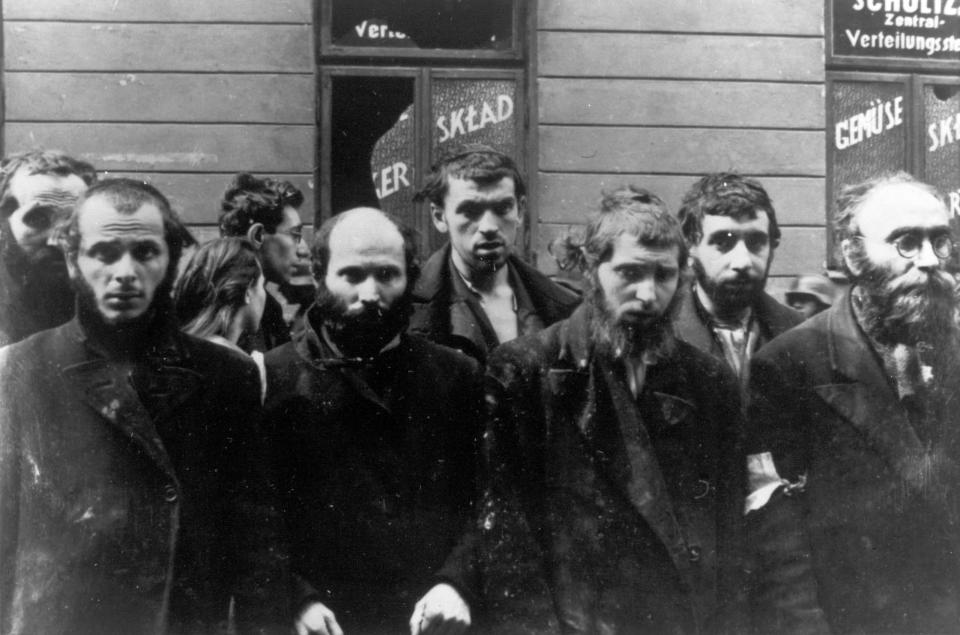 FILE - In this April/May 1943 file photo, a group of religious Jews are being held under arrest by German SS soldiers during the destruction of the Warsaw Ghetto by German troops, following an uprising in the Jewish quarter. Friday, April 19, 2013 anniversary of the start of the Warsaw ghetto uprising, a revolt that ended in death for most of the fighters yet gave the world an enduring symbol of resistance against the odds. (AP Photo)