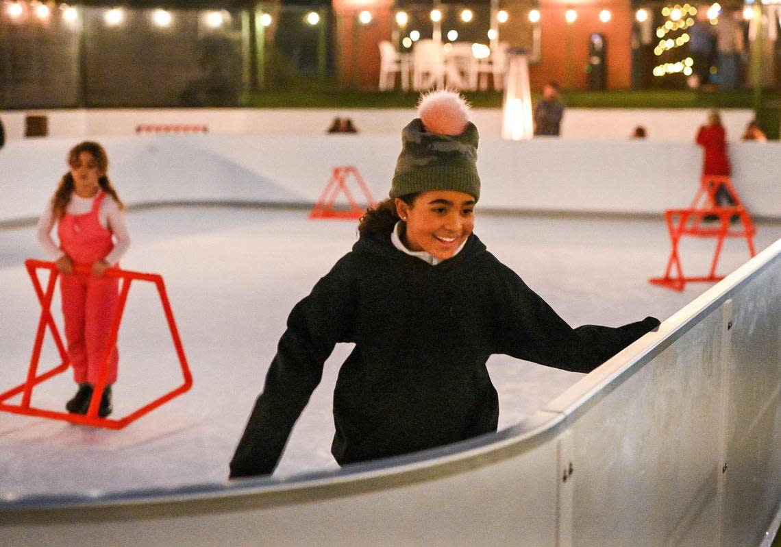 Courtney Stafford, 10, of Walnut Creek enjoys an evening skate on the new skate rink at The Pines Resort on Bass Lake on Wednesday, Dec. 28, 2022.