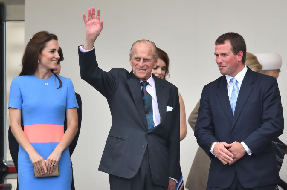 (left to right) The Duchess of Cambridge, the Duke of Edinburgh and Peter Phillips  in the Royal Box for the Patron's Lunch in The Mall, central London, in honour of the Queen's 90th birthday. PRESS ASSOCIATION Photo. Picture date: Sunday June 12, 2016. The Queen's grandson Peter Phillips has masterminded the street party for 10,000 people, to mark the monarch's patronage of more than 600 charities and organisations. See PA story ROYAL Birthday. Photo credit should read: Dominic Lipinski/PA Wire 