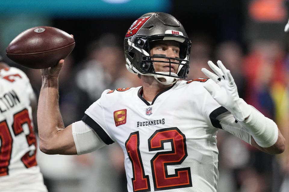 FILE - Tampa Bay Buccaneers quarterback Tom Brady (12) sets back to pass during the first half of an NFL football game against the Atlanta Falcons, Sunday, Jan. 8, 2023, in Atlanta. Brady, who won a record seven Super Bowls for New England and Tampa, has announced his retirement, Wednesday, Feb. 1, 2023. (AP Photo/John Bazemore, File)