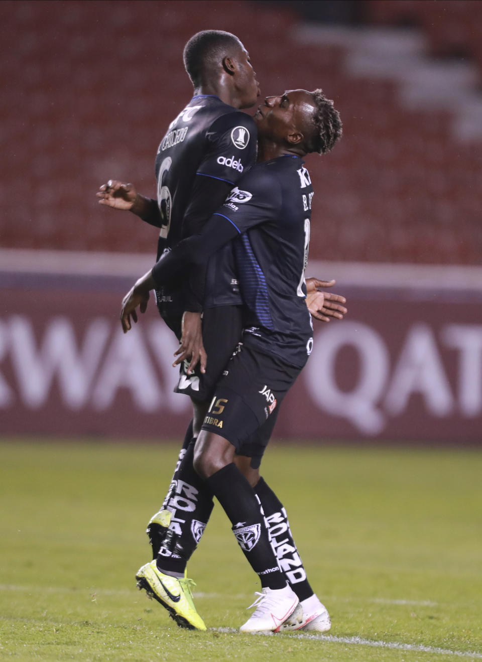 Moises Caicedo of Ecuador's Independiente del Valle celebrates with his teammate Beder Caicedo after he scored his side's first goal against Brazil's Flamengo during their Copa Libertadores soccer match in Quito, Ecuador, Thursday, Aug. 17, 2020. (Jose Jacome/Pool via AP)