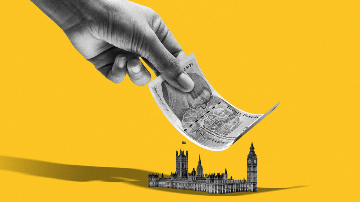  Photo composite of a giant hand with paper money over Westminster. 