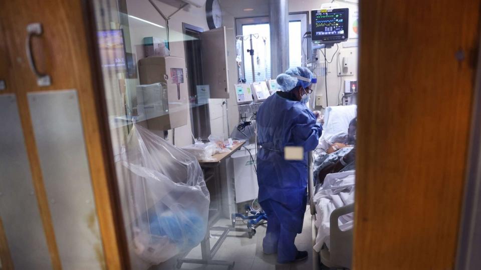 PHOTO: Intensive Care Unit nurse Meriem Saleh treats a COVID-19 patient in the ICU at Roseland Community Hospital, Dec. 14, 2020, in Chicago.  (Scott Olson/Getty Images, FILE)