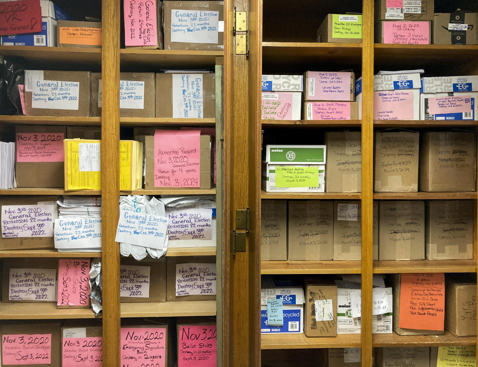 Cabinets at the Carroll County Board of Elections in Carrollton, Ohio, stand packed on Tuesday, Sept. 27, 2022, with 2020 ballots and other documents that members of the public have demanded be retained in records requests and harshly worded emails. (AP Photo/Julie Carr Smyth)