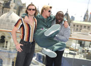 <p>Aaron Taylor-Johnson and Brian Tyree Henry help Brad Pitt fly high on July 20 at a <em>Bullet Train</em> photo call in London. </p>