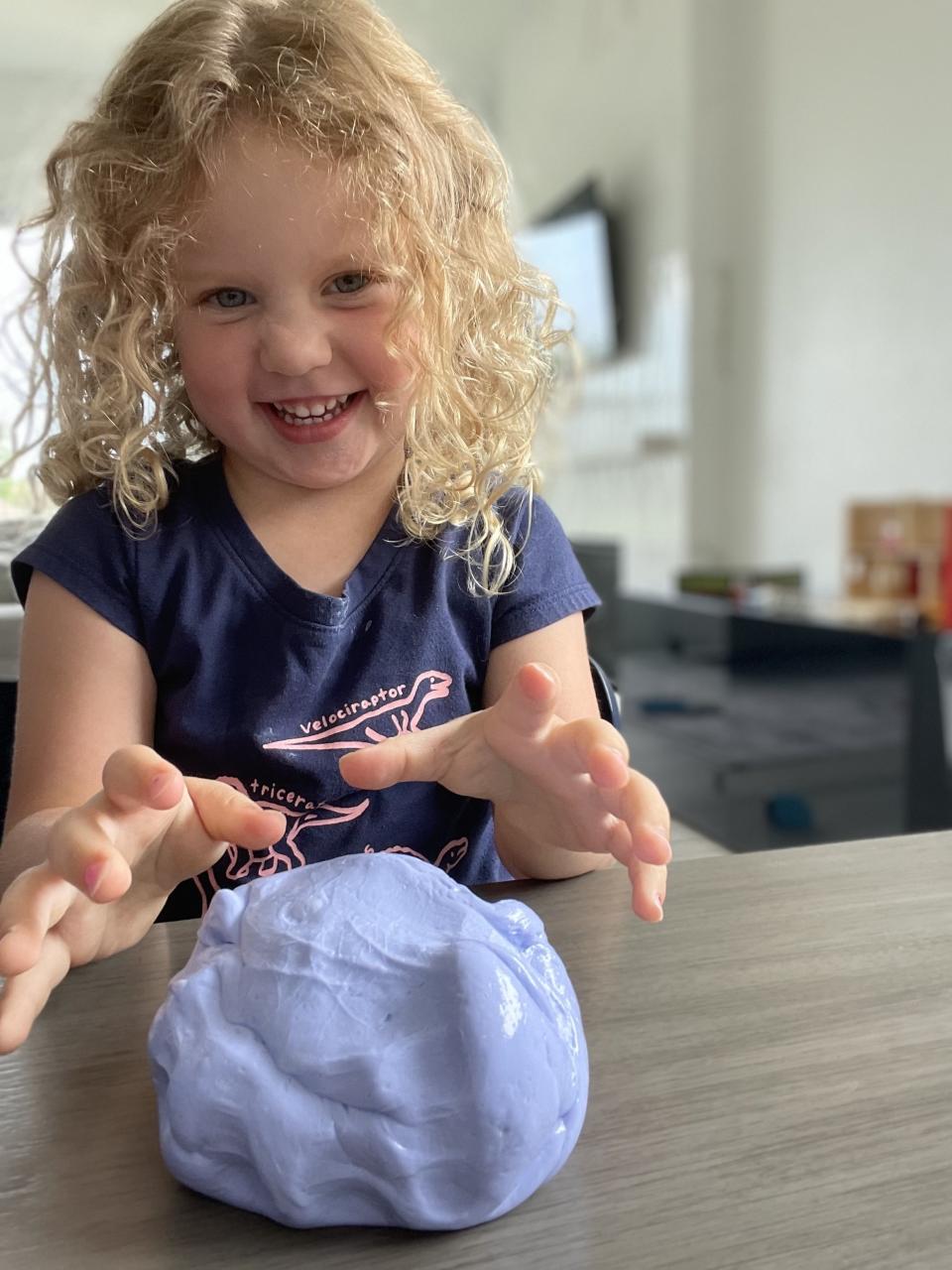 author's daughter playing with slime