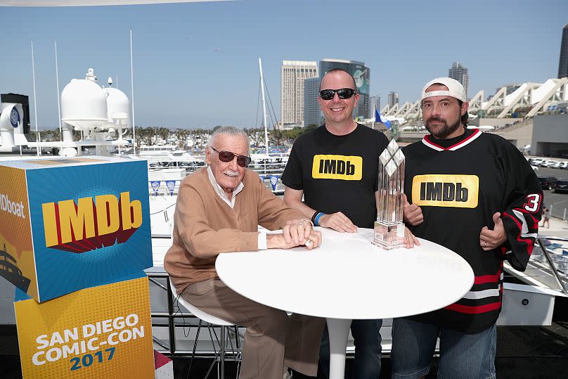 IMDb founder Col Needham and Kevin Smith present Stan Lee with the first-ever IMDb STARmeter Award for Lifetime Achievement in 2017.