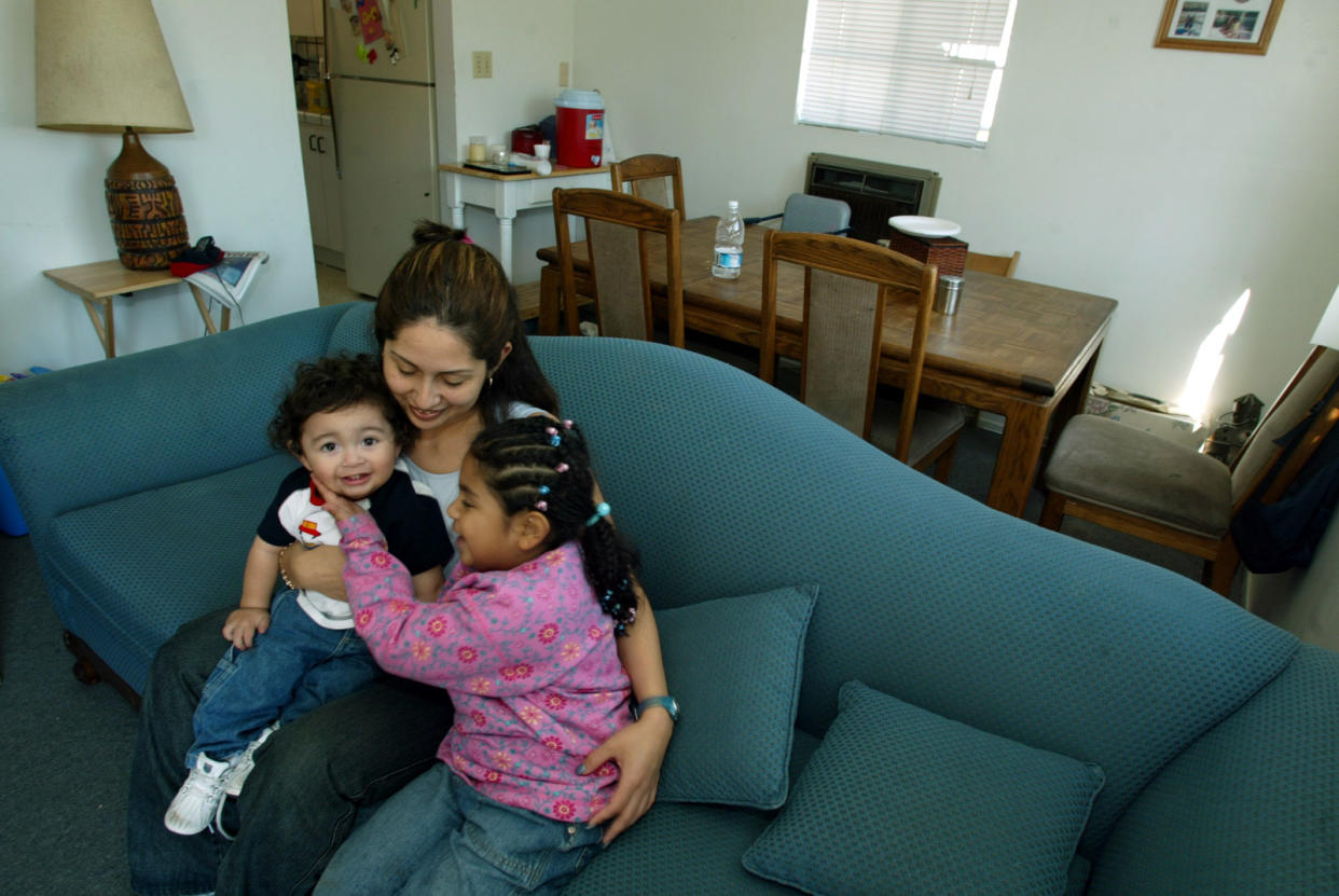 Roxanna Villa, 25, with daughter Miranda Villa, age 6, and son Dustin Serrano, age 1, in her home. She was able to buy the house due to the earned income tax credit, a lucrative break for the working poor. (Credit: Gary Friedman/Los Angeles Times via Getty Images)