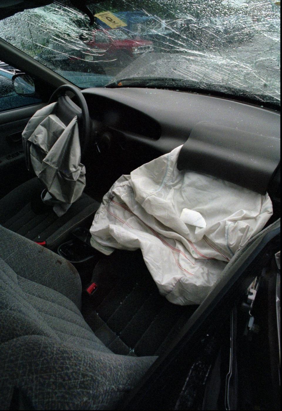 A deployed air bag is seen in a passenger seat Tuesday, Sept. 17, 1996 in Nashua, N.H. where 5-year-old Eduardo Cabrera of Nashua, N.H., was killed in an auto accident Friday. Police said the death should not have happened in what is considered a minor accident and that the deployed airbag may have been what broke Cabrera's neck. Thousands of times a day in America a potentially deadly drama is played out, a combination of kids, cars, airbags and improperly installed child seats are a dangerous mix that worries the National Transportation Safety Board.