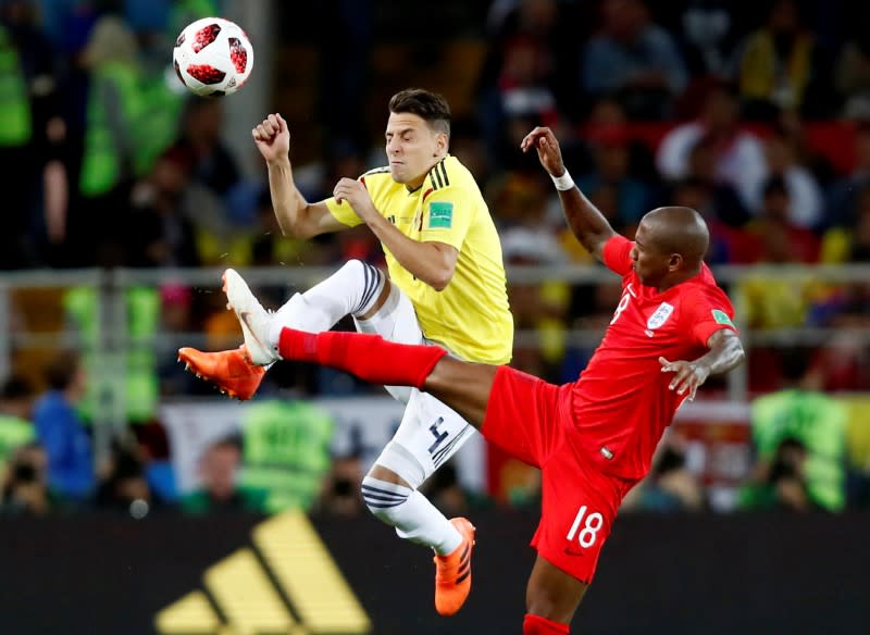 <p>Colombia’s Santiago Arias in action with England’s Ashley Young. REUTERS/Maxim Shemetov </p>