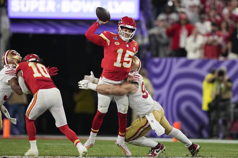 Kansas City Chiefs quarterback Patrick Mahomes (15) is hurried by San Francisco 49ers defensive end Nick Bosa during the second half of the NFL Super Bowl 58 football game Sunday, Feb. 11, 2024, in Las Vegas. (AP Photo/Brynn Anderson)