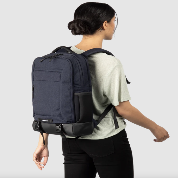 model wearing blue backpack