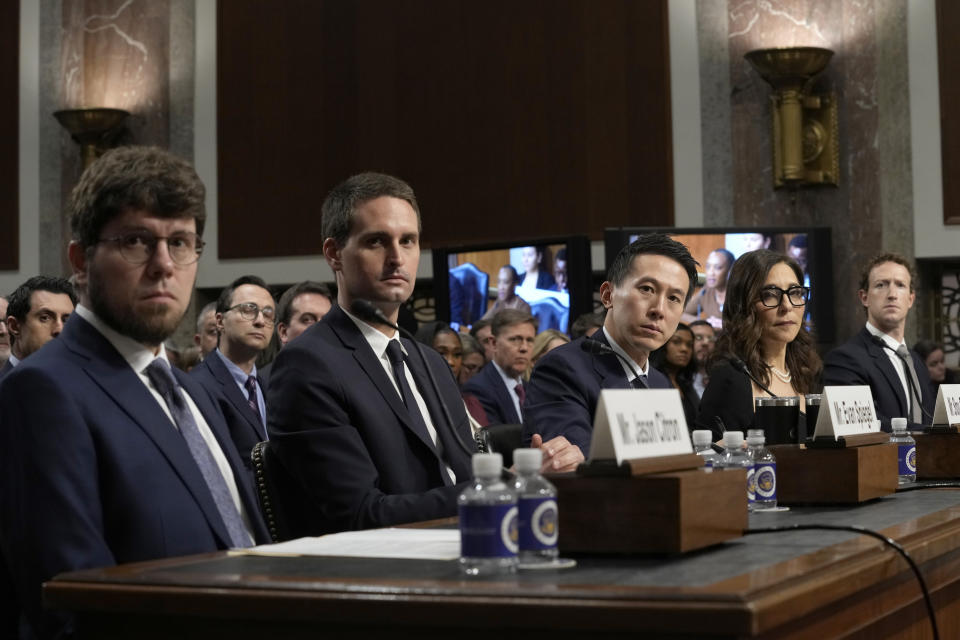 Social media platform heads, from left, Discord CEO Jason Citron, Snap CEO Evan Spiegel, TikTok CEO Shou Zi Chew, X CEO Linda Yaccarino, and Meta CEO Mark Zuckerberg, listen during a Senate Judiciary Committee hearing on Capitol Hill in Washington, Wednesday, Jan. 31, 2024, to discuss child safety online. (AP Photo/Susan Walsh)