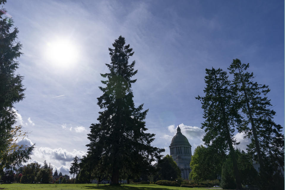 The Washington state Capitol is shown under clear skies, Wednesday, Oct. 14, 2020, in Olympia, Wash., in contrast to several weeks earlier when the area was choked with smoke. Wildfires churning out dense plumes of smoke as they scorch huge swaths of the U.S. West Coast have exposed millions of people to hazardous pollution levels, causing emergency room visits to spike and potentially thousands of deaths among the elderly and infirm, according to an Associated Press analysis of pollution data and interviews with physicians, health authorities and researchers. (AP Photo/Ted S. Warren)