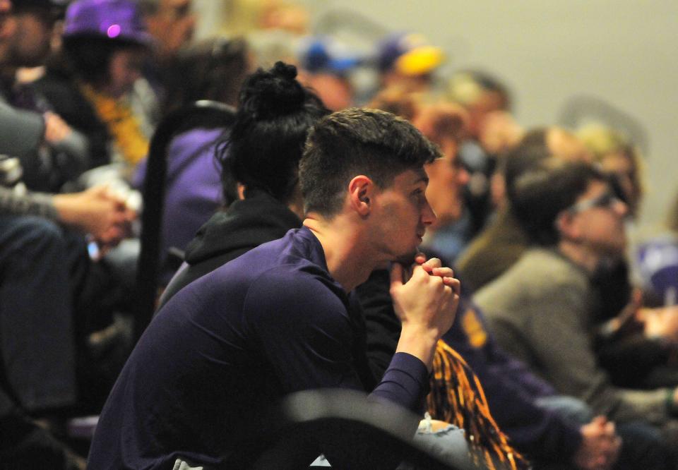 Korbyn Haley watches pregame festivities during a gathering of fans at Ashland University’s Kates Gymnasium Saturday to watch the AU women’s basketball team play Minnesota Duluth for the Div. II title. Haley is a member of the school’s football and track teams.