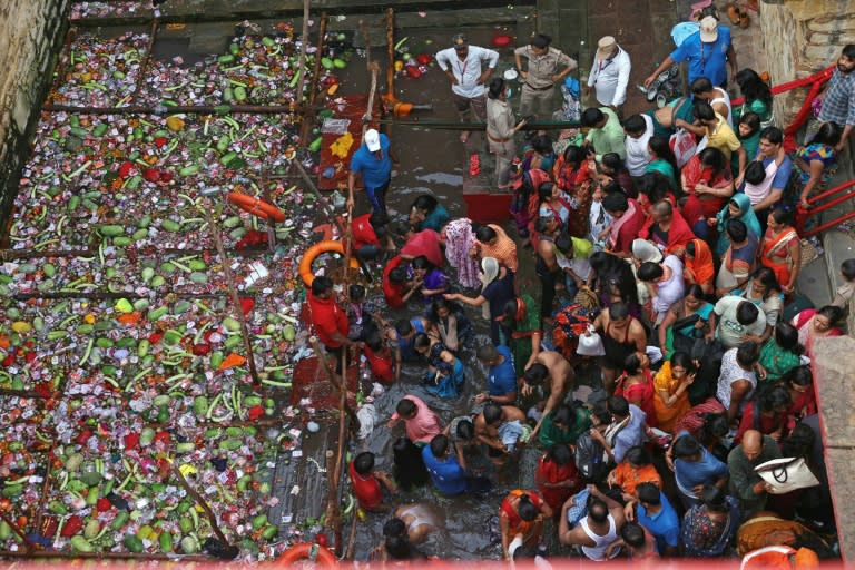 Fertility rites at the Lolark Kund well have taken place for centuries, if not longer. Thousands of couples and devotees climb down steep steps into the dark waters to bathe (Niharika KULKARNI)