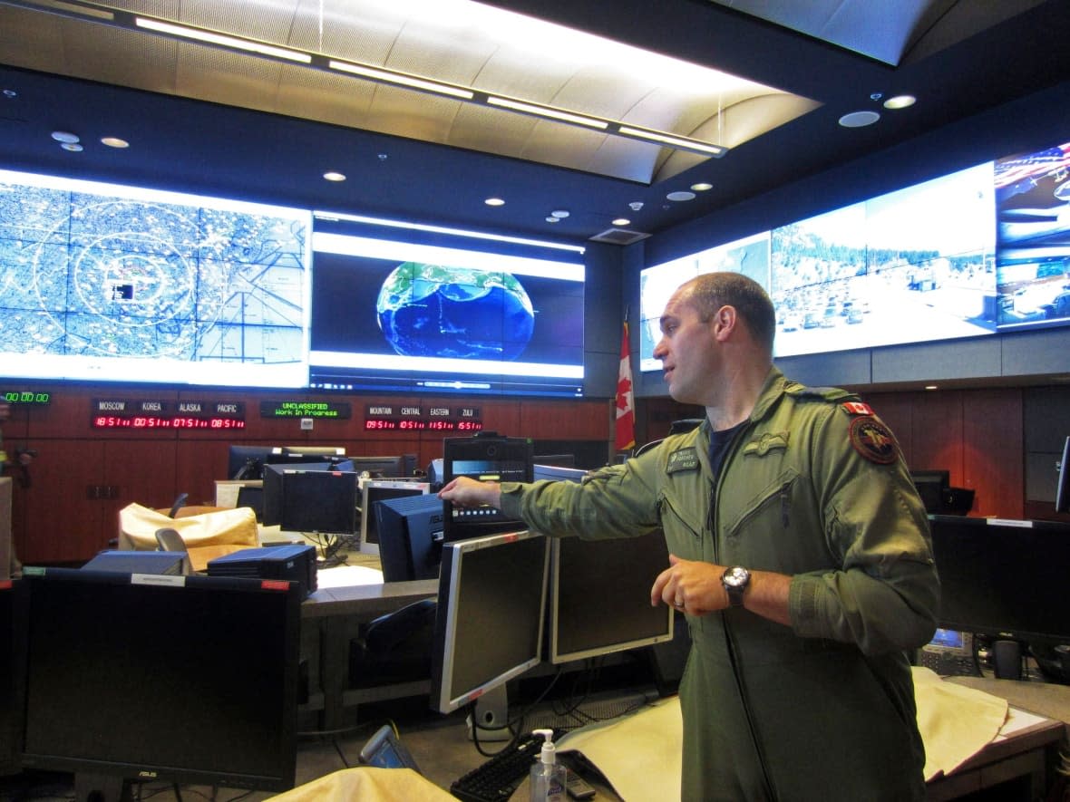 In this 2018 photo, Royal Canadian Air Force Col. Travis Morehen speaks in the North American Aerospace Defense Command (NORAD) command center inside Cheyenne Mountain, Colo. NORAD on Saturday shot down a 'high-altitude airborne object' over northern Canada. (Dan Elliott/The Associated Press - image credit)