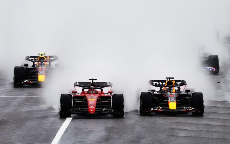 Max Verstappen of the Netherlands driving the (1) Oracle Red Bull Racing RB18 and Charles Leclerc of Monaco driving the (16) Ferrari F1-75 battle for track position into turn one at the start during the F1 Grand Prix of Japan at Suzuka International Racing Course on October 09, 2022 in Suzuka, Japa - Getty Images