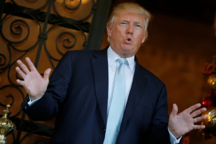 Donald Trump delivers brief remarks to reporters at the Mar-a-lago Club in Palm Beach, Fla. (Photo: Jonathan Ernst/Reuters)