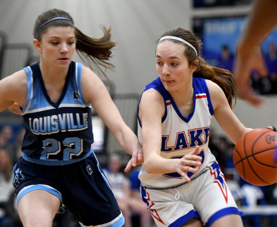 Louisville's Lexi Wasara puts pressure on Lake's Hayden Croyle in girls basketball at Lake.  Saturday, February 04, 2023.