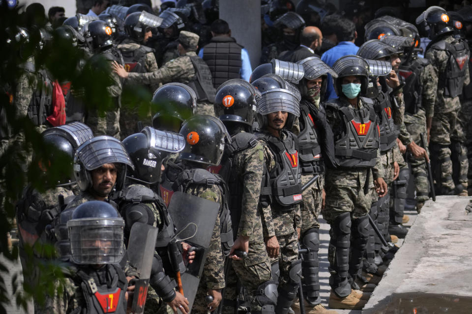 Paramilitary troops take position to ensure security at the premises of Islamabad High court, where Pakistan's former Prime Minister Imran Khan is due to appear, in Islamabad, Pakistan, Friday, May 12, 2023. A high court in Islamabad has granted former Prime Minister Imran Khan a two-week reprieve from arrest in a graft case and granted him bail on the charge. (AP Photo/Anjum Naveed)