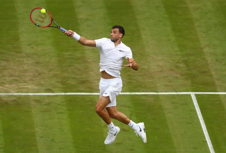 <p>Grigor Dimitrov of Bulgaria plays a forehand during the Men’s Singles second round match against Gilles Simon of France on day four of the Wimbledon Lawn Tennis Championships at the All England Lawn Tennis and Croquet Club on June 30, 2016 in London, England. (Photo by Julian Finney/Getty Images)</p>