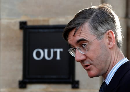 Britain's Conservative Party MP Jacob Rees-Mogg walks outside the Houses of Parliament in London