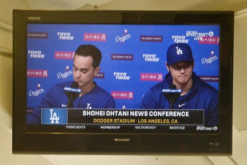 The Los Angeles Dodgers' Shohei Ohtani delivers a statement during a closed press conference as seen on a TV in the press box at Dodger Stadium in Los Angeles on Monday. Ohtani denied ever betting on baseball or other sports in his first public comments since a scandal involving his long-time interpreter erupted last week. Photo by Jim Ruymen/UPI