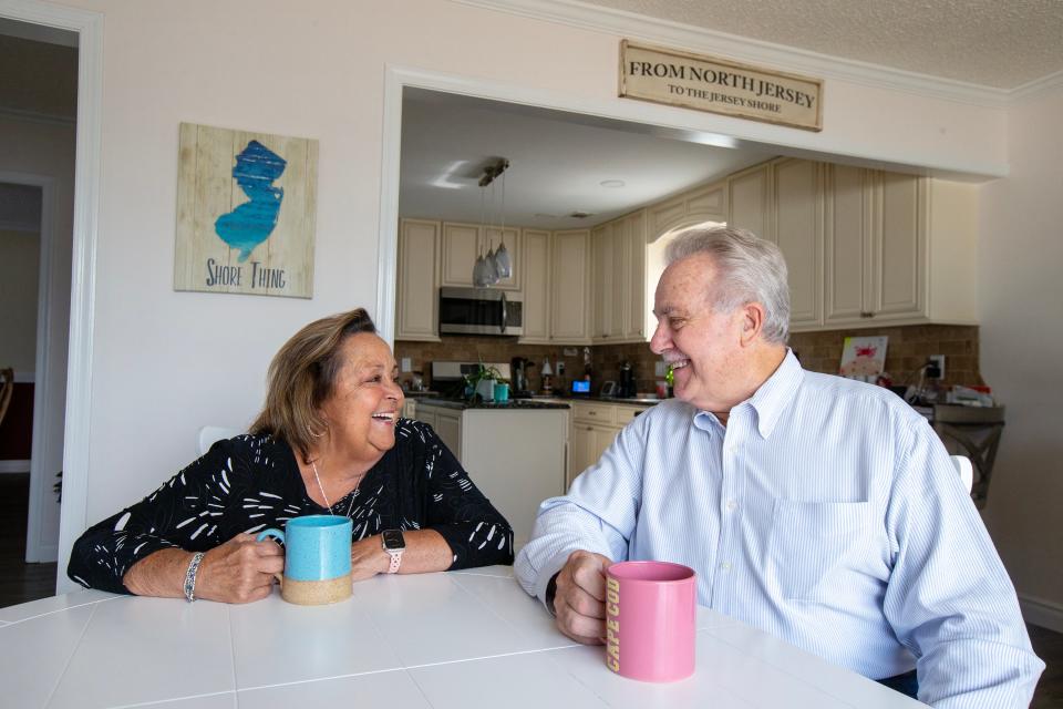 Michele Corcione of Toms River, who received a lung transplant in 2023, laughs with her husband, Jeff, at their kitchen table in Toms River, NJ Thursday, April 24, 2024.