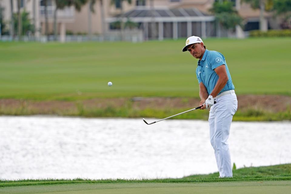 Rickie Fowler chips on to the 18th green during the third round of the 2021 Honda Classic golf tournament. Mandatory Credit: Jasen Vinlove-USA TODAY Sports