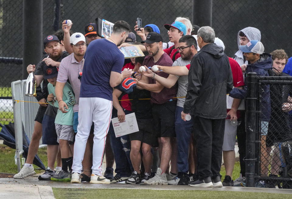 Houston Astros right fielder Kyle Tucker signs autographs for fans during workouts for Astros pitchers and catchers at CACTI Park of the Palm Beaches, Sunday, Feb. 18, 2024, in West Palm Beach, Fla. (Karen Warren/Houston Chronicle via AP)