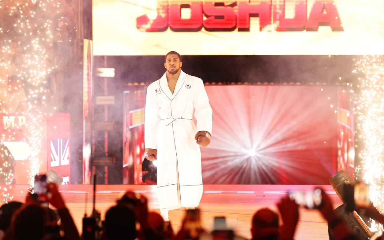 Anthony Joshua walks to the ring during his ring-walk prior to the Heavyweight fight between Anthony Joshua and Francis Ngannou on the Knockout Chaos boxing card at the Kingdom Arena on March 08, 2024 in Riyadh, Saudi Arabia