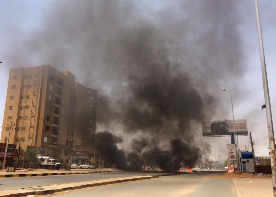 Burning tires set by protesters produce black smoke on road 60, near Khartoum's army headquarters, in Khartoum, Sudan, Monday, June 3, 2019. Sudanese protest leaders say at least 13 people have been killed in the military's assault on the sit-in outside the military headquarters in the capital, Khartoum. The protesters have announced they are suspending talks with the military regarding the creation of a transitional government. (AP Photo)
