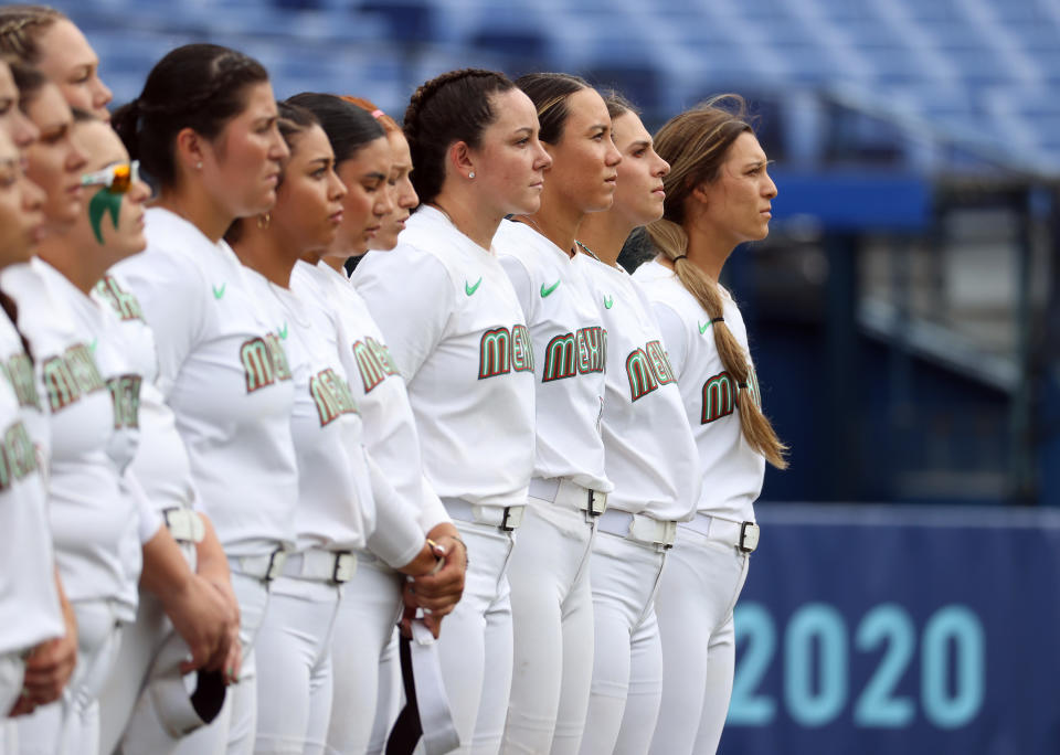 YOKOHAMA, JAPAN - JULY 27: Team Mexico stand on the infield for pregame ceremonies before the women's bronze medal game between Team Mexico and Team Canada on day four of the Tokyo 2020 Olympic Games at Yokohama Baseball Stadium on July 27, 2021 in Yokohama, Kanagawa, Japan. (Photo by Koji Watanabe/Getty Images)